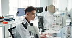 Science, laboratory and research with man, computer and microscope data analysis for report. Biotechnology, scientist and medical journal study with feedback and professional with healthcare article