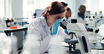 Lab, scientist and woman with microscope, medical research and notes for breakthrough, analysis or tech. Healthcare, serious and person with equipment for science, examination or diagnosis of disease