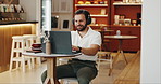 Headphones, happy and man in coffee shop for freelance creative career with online magazine. Audio tech, laptop and male journalist listening to podcast, music or radio in cafe for remote work.
