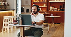 Headphones, thinking and man in coffee shop for freelance creative career with online magazine. Audio tech, laptop and male journalist listening to podcast, music or radio in cafe for remote work.