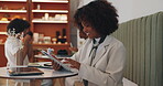 Tablet, typing and remote work with woman in cafe for hospitality manager, research and vision. Reflection, freelancer and restaurant with African person in coffee shop for planning and email