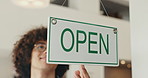 Man, cafe and open sign on door, small business and storefront or start of service message. Display, worker and information to customer on poster, coffee shop and notice for beginning of hospitality