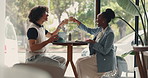 Conversation, man and woman in cafe, cheers and celebration with happiness, joy and excited. People, restaurant and friends with cappuccino, promotion and positive news with care and cheerful