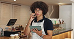 Phone call, man and barista with tablet in coffee shop for online order confirmation with customer. Digital technology, restaurant and waiter on mobile discussion for communication with inventory.