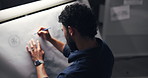 Man, drawing and design for car in workshop, inspiration and editing process for deadline at night. Person, paper and canvas with sketch for electric vehicle, transport and back in studio at company
