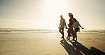 Family, children and walk by holding hands at beach for summer vacation, travel trip and bonding together. Parents, kids and security on ocean of holiday getaway, weekend journey and nature adventure