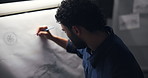 Man, drawing and design for car in studio, inspiration and editing process for deadline at night. Person, paper and canvas with sketch for electric vehicle, transport and back in workshop at company