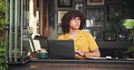 Coffee shop, student and man waiting on laptop for online project, digital learning and research. University, restaurant and person check time on watch for meeting, appointment or study group in cafe