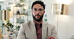 Face, corporate and confident business man with pride, serious and financial advisor in office. Portrait, glasses and professional entrepreneur with arms crossed, wealth consultant and worker in UAE