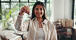 Face, moving and woman with keys, smile and proud of investment with new home, mortgage and lounge. Happy, owner and person with cardboard in house, real estate and loan for property or confident