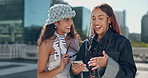 Friends, talking and women in city, smartphone and conversation with communication. People, outdoor and girls in street, cellphone and social media with funny meme, email notification or website info