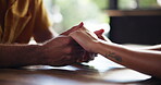 Couple, cafe table and holding hands for love in relationship, support and affection for bonding. Restaurant, touch and security in connection, marriage partnership and fingers for dating romance