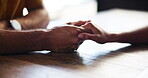 Couple, table and holding hands for love in relationship, support and affection for bonding. Restaurant, touch and security in connection, marriage partnership and fingers for romance date at cafe