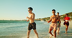 Vacation, people and friends running in ocean water for freedom, travel and adventure. Outdoor, sea and group at beach for holiday, splash and gen z students with energy for celebration together