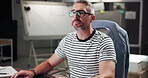 Night, creative and man with computer, glasses and copywriter with ideas for project and article. Business, copywriting and mature person with tech for blog, contemplating and thoughtful for task