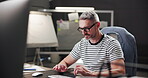 Business, creative and man with computer, glasses and copywriter with ideas for project and article. Typing, copywriting and mature person with tech for blog, contemplating and thoughtful for task