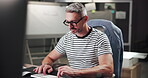 Night, creative and man with computer, typing and copywriter with ideas for project and article. Business, copywriting and mature person with tech for blog, contemplating and thoughtful for task