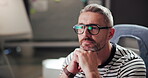 Business, creative and man with computer, reading and copywriter with ideas for project and article. Glasses, copywriting and mature person with tech for blog, contemplating and thoughtful for task