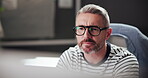 Business, glasses and man with computer, reading and copywriter with ideas for project and article. Creative, copywriting and mature person with tech for blog, contemplating and thoughtful for task
