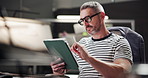 Business, tablet and man in office, creativity and decision with internet, thinking and network. Person, graphic designer or employee in workplace, illustrator and design editing with app for project