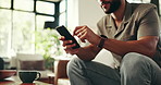 Relax, phone and typing with hands of man on sofa for social media, streaming or online update. Networking app, conversation and post with closeup of person in living room at home for chat and mobile