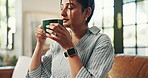 Home, sofa and woman with smell for coffee, espresso and comfortable on weekend in living room. House, female person and blow in morning for warm cappuccino, beverage and aroma with relax on couch