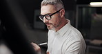 Night, drawing and man with glasses, engineering and illustration for project management. Employee, architecture and professional in workspace, eyewear and deadline with building design and creative