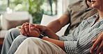 Couple, holding hands and hug for comfort in home, grief and kindness of support with miscarriage. Love, people and together for loss in living room, security and embrace wife for bonding in trauma