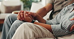 Couple, holding hands and closeup on couch in home for love, care and bonding with connection in living room. People, trust and loyalty with partnership, embrace and support in relationship at house