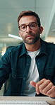 Face, video call and business man listening in startup for training, online meeting or virtual conference. Webinar, talk or creative worker in office for feedback, advice or typing on keyboard in pov