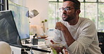 Man, eating and reading report at desk in office with salad, multiscreen setup and working lunch. Business person, graphs and review for project management, proposal deadline and diet snack in home