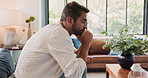 Stress, thinking and man with depression in home, reflection and worry with bankruptcy or financial crisis. Anxiety, sad and person in living room with concern for fail, mistake and mental health