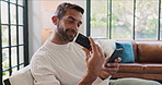 Sofa, man and credit card with smartphone for payment, banking app and online shopping at home. House, couch and happy person with mobile for debit details, ecommerce and subscription for platform