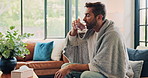 Man, blanket and drinking tablets in home, sick and medication treatment for hayfever allergies. Couch, recovery prescription and water for antibiotics in living room, supplements and remedy illness