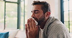 Sickness, blowing nose and tired with man on sofa for fatigue, virus infection and flu season. Sinus allergy, disease and sneezing with person and tissue in living room of home for cold and illness