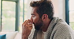Man, sick and nose spray in home, application and liquid medication for hayfever treatment. Couch, recovery and saline solution for respiratory influenza in living room, blanket and remedy illness