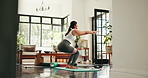 Yoga, resistance band and woman squat in home for exercise, workout and training for muscle strength. Morning, house and person for wellness, health and stretching for pilates, balance or flexibility