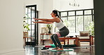 Exercise, resistance band and woman in home for squat, yoga workout and training for muscle strength. Morning, house and person for wellness, health and stretching for pilates, balance or flexibility