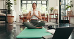 Woman, yoga and lotus position with tablet for online class, tutorial or fitness lesson on mat at home. Female person, yogi and warm up with technology for tips, holistic steps or zen pilates