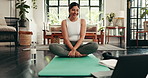 Woman, yoga and video call with laptop for online class, tutorial or fitness lesson on mat at home. Female person, yogi and warm up discussion with technology for tips, holistic steps or zen pilates