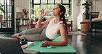 Woman, pilates and home break with water bottle, drinking mineral liquid and core strength. Breathing, relax and laptop for online instruction video, recovery exercise and hydration on lounge floor