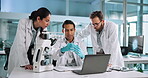 Scientist, laptop and people with beaker in lab for pharmaceutical study, chemical trial and cure development. Science, teamwork and liquid sample for medical research, drug innovation and experiment
