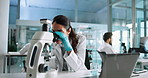Science, laboratory and woman with microscope on laptop for research, medical study and vaccine development. Healthcare, biology and scientist with equipment for discovery, experiment and medicine