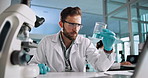 Laptop, science or man with chemical for medical experiment or inspection in lab at night. Chemistry, biotechnology or scientist check beaker with liquid for research, pharma test or cure development