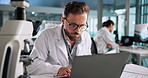 Tablet, scientist and man with laptop for research, experiment results or innovation in laboratory. Microbiology, biotechnology and science professional with medical study, cure development or scroll