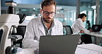 Tablet, scientist or man with laptop for medical experiment, results or innovation in lab at night. Microbiology, biotechnology or science professional with research study, cure development or scroll