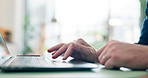 Hands, scroll and man in office, keyboard and internet with research for stock market, laptop and email. Closeup, person and investment banker with pc, website for financial news or report for profit