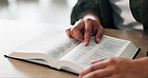 Reading, hands and man with bible in home for religion study, worship or spiritual journey. Hope, gratitude and male person with scripture in holy book for peace, faith or guidance in living room.