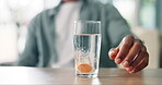 Hands, person and dissolve pills in water for healthcare, wellness or daily medical painkiller in home. Medicine, closeup and drugs for prescription treatment, vitamin supplements or bubbles for fizz