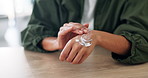 Home, hands and woman with skincare, cream and dermatology with grooming, cosmetics and treatment. Closeup, apartment and person with lotion, moisturiser and creme with shine, glow and healthy skin